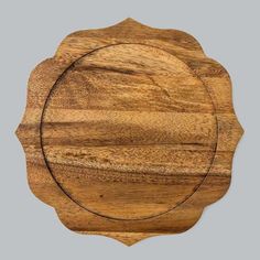 a wooden plate with a circular design on the front and sides, set against a gray background