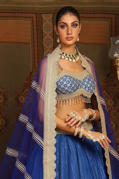 Electric blue toned attached cancan cotton simmer chanderi crinkled lehenga with wave style chevron gota embroidery and heavy tassel ornamentations. Paired with a noodle strap flattering sweetheart neckline padded blouse with geometric gota jaal embroidery, dori embroidered hem detail and heavily embellished scallop border net dupatta with gold toned placement stripe details. - Aza Fashions Jaal Embroidery, Gota Embroidery, Noodle Strap, Scallop Border, Embroidered Hem, Padded Blouse, Bridal Lehengas, Lehenga Blouse, Net Dupatta