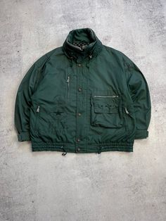 This Bogner Expedition Vintage Men's Green Jacket is a must-have for any ski or outdoor enthusiast. Made with high-quality polyester material, this mid-length jacket features a full zip closure and zipped pockets for your convenience. The oversized jacket is hooded and comes in a retro 90s style, perfect for all seasons. The green jacket is a size 52 and has a regular fit, making it suitable for most men. The jacket is made in Italy and is perfect for winter and fall seasons. The jacket's features include all-season suitability, making it a great investment for any outdoor activity. Size 52 (see measurements) The length of the sleeve from the neck is 80 cm From shoulder to shoulder - 65 cm The length of the back is 73 cm Condition 8/10  See all photos and read description.   If you need an Winter Outerwear For Outdoor Activities With Zip Fly, Green Windbreaker With Multiple Pockets For Winter, Urban Winter Sport Coat For Outdoor, Functional Winter Windbreaker With Ykk Zipper, Winter Track Jacket With Zipper For Outdoor Activities, Urban Winter Windbreaker With Zip Fly, Nylon Windbreaker With Pockets For Winter Sports, Ski Season Nylon Outerwear For Outdoor, Weatherproof Track Jacket For Winter Outdoor Activities