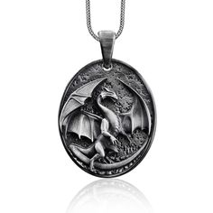 a pendant with a dragon on it