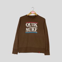 Vintage Rare QUIKSILVER Crewneck Sweatshirt Big Logo QUIKSLILVER Surf Jumper Pullover QUIKSILVER Sweater Brown Colour Unisex Medium Size CONDITION :- ✅GOODUSED CONDITION. ✅NO STAINS  ✅NO HOLE ITEM DESCRIPTION:- ✅SIZE: M ✅MATERIAL : COTTON ✅THIS USED & VINTAGE ITEMS, SO DON'T EXPECTED IT TO BE LIKE NEW CONDITION!! MEASUREMENT:- ✅ARMPIT TO ARMPIT : 19 INCH ✅LENGHT BACK COLOR/NECK TO HEM : 25 INCH ✅SHOWLDER : 18 ✅SLEEVE LENGTH: 22.5 INCH PLEASE REFER PHOTO BEFORE ORDER ALL MEASUREMENTS ARE TAKEN WI Brown Crew Neck Sweater For Streetwear, Vintage Sweater With Letter Print And Long Sleeves, Vintage Long Sleeve Sweater With Letter Print, Casual Crew Neck Top With Ribbed Cuffs, Brown Crew Neck Top With Letter Print, Brown Graphic Print Cotton Sweater, Brown Cotton Sweater With Graphic Print, Brown Relaxed Fit Sporty Sweater, Casual Brown Long Sleeve Sweater