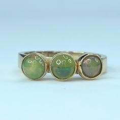 Ornate 14k Yellow Gold Stackable Statement Ring. It Has Three Round Natural Opal Cabochon Bezels, Approx. 4.5-5.0m. Weight 3.9 Grams, Size 6.5. Excellent Vintage Condition. Yellow Gold Polished Opal Ring, Gold Multi-stone Opal Ring With Oval Cabochon, 14k Gold Cabochon Jewelry For Anniversary, Anniversary Yellow Gold Opal Cabochon Ring, Anniversary 14k Gold Cabochon Jewelry, Gold Multi-stone Oval Cabochon Ring, Fine Jewelry Yellow Gold Opal Ring With Polished Finish, Heirloom Style Gold Opal Ring With Bezel Setting, Gold Opal Ring With Polished Finish