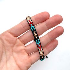 "Handmade Southwestern seed bead bracelet - Small glass seed beads are Toho size 8/0 - Black bracelet cord - Adjustable slide knot - Can comfortably fit wrists ranging from 5.5 - 8.5\" - Crafted in California - Ships everywhere - Combined shipping included" Bohemian Tiny Beads Friendship Bracelets For Festivals, Bohemian Friendship Bracelets With Tiny Beads For Festivals, Bohemian Resizable Heishi Beads Bracelets, Southwestern Multicolor Friendship Bracelets For Festivals, Bohemian Adjustable Beaded Friendship Bracelets, Southwestern Multicolor Festival Friendship Bracelets, Handmade Adjustable Southwestern Friendship Bracelets, Adjustable Southwestern Friendship Bracelets, Southwestern Adjustable Jewelry With Colorful Beads