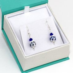 Delft Blue Ceramic Earrings 925 Sterling Silver & Blue Floral Victorian Earrings, Gift for Her 100% of net profits donated to the Hawaii Wildlife Fund to help and protect the critically endangered Honu'ea Sea Turtles. *Minimalist Elegance. Cute and Dainty Dangle Drop. For all ages *Painted Ceramic Delft Style Floral Bead, 8mm. *Sapphire Blue Glass Bead *925 Sterling Silver French Hook Earring and beads (CAN BE MADE WITH STERLING SILVER POST. JUST LET ME KNOW). *The Earrings are presented in Blue Sterling Silver Earrings For Jewelry Making, Blue Drop Earrings As Gift For Her, Blue Round Earrings For Gift, Blue Drop Earrings For Anniversary, Blue Nickel-free Earrings For Anniversary, Nickel-free Blue Earrings For Anniversary, Blue Sterling Silver Drop Earrings, Blue Sterling Silver Jewelry For Her, Blue Earrings With Ear Wire For Anniversary