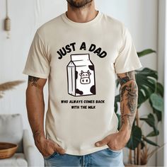 Just a Dad who Always Comes Back with the Milk T-Shirt: This classic unisex jersey short sleeve tee fits like a well-loved favorite. Soft cotton and quality print make users fall in love with it over and over again. These t-shirts have-ribbed knit collars to bolster shaping. The shoulders are tapered for a better fit over time. Dual side seams hold the garment's shape for longer.  .: Made with 100% Airlume combed and ring-spun cotton, a lightweight fabric (4.2 oz/yd² (142 g/m that is easy to lay Father's Day Relaxed Fit Text Print Tops, Father's Day Text Print Relaxed Fit Tops, Casual Crew Neck Tops For Father's Day, Family Matching Crew Neck Shirt With Letter Print, White Shirt With Funny Print For Father's Day, Casual Top With Text Print For Father's Day, Casual Cotton Tops For Father's Day, Father's Day Letter Print Crew Neck Top, White Crew Neck Shirt For Father's Day