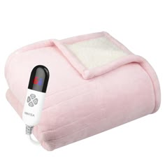 a pink blanket with an electric heating pad