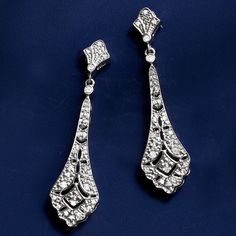 Ross-Simons - .15 ct. t. w. Diamond Openwork Drop Earrings in Sterling Silver. Jazz up your look with our embellished pair. The sterling silver vintage-style designs glitter with .15 ct. t. w. diamonds, boasting intricate openwork. Hanging length is 1 1/2". Post/clutch, diamond openwork drop earrings. Diamond birthstones are the perfect gift for April birthdays. Classic Chandelier Earrings With Diamond Accents For Evening, Vintage Silver Dangle Bridal Earrings, Silver Vintage Bridal Earrings For Formal Occasions, Vintage Silver Bridal Earrings For Formal Occasions, Formal Rhinestone Drop Diamond Earrings, Silver Chandelier Earrings With Rhinestones For Anniversary, Vintage Silver Bridal Earrings For Evening, Silver Vintage Chandelier Earrings For Formal Occasions, Vintage Silver Chandelier Earrings For Formal Occasions