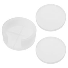 three white plates sitting next to each other