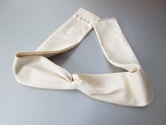 "This beautiful and elegant pure silk belt features criss-cross front detail that has very flattering and visually slimming effect. This is a couture hand made ribbon belt. This belt measures 2 1/2\" wide and it is fitted to your measurements to fit your waist. The belt is finished with the matching buttons / loops closure. The belt can also be ordered without the buttons / loops added if you are planing to have it sewn on to your dress. Available in white or ivory color silk shantung and in dar Bridal Sash Belt, Satin Belt, Wedding Belt, Crystal Belt, Wedding Sash Belt, Cloth Belt, Couture Bridal, Dress Sash, Ribbon Belt