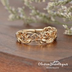 a gold ring sitting on top of a wooden table