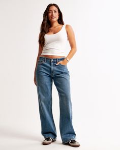 Our Curve Love low rise baggy jeans in a medium wash with a clean hem. This fit features a 8.5” low rise, is slightly relaxed at waist and hips, and eases at the thigh into a baggy, full-length leg shape. We recommend buying your true size for a baggier fit. Size down for a closer fit. The viral fit that eliminates waist gap: Curve Love features additional room through the hip and thigh for curve-hugging comfort. This jean is made from our vintage stretch fabric which features both an authentic Jeans For Big Thighs, Low Rise Baggy Jeans, Baggy Jeans Outfit, Baggy Jean, Abercrombie Jeans, Low Waist Jeans, Women's Bottoms, Style Inspiration Fall, Curvy Jeans