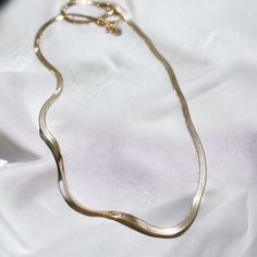 "Looking for the perfect elegant, easygoing accessory? We've got you covered with the herringbone Necklace in 18k Gold Vermeil. Featuring a large herringbone chain, this elevated necklace lets you easily switch up your look for every day and every occasion. Available in 18\" length. Metal 18k Yellow Gold Vermeil What is Vermeil?Vermeil (that's pronounced ver-may) is a gold plating technique that dates back to the 19th century. While other jewelers plate over less durable metals, our vermeil starts with a Sterling Silver base and is plated with just over 2.5 microns of 18k Gold to create a more timeless piece, worthy of the Demi-Fine name." Elegant Gift Herringbone Necklace Tarnish Resistant, Gold Minimalist Herringbone Necklace As Gift, Gold Minimalist Herringbone Necklace Gift, Minimalist Gold Plated Snake Chain Necklace As A Gift, Chic Delicate Chain Herringbone Necklace As Gift, Minimalist Snake Shape Jewelry With Delicate Chain, Minimalist Snake Chain Necklace With Clavicle Chain, Dainty Tarnish Resistant Snake Chain Necklace, Gold Minimalist Herringbone Necklace With Clavicle Chain