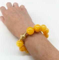 Material: 18k yellow gold

Stone Type/Carat Weight: Natural Butterscotch Amber

Dimensions: beads - 15.5mm” interior diameter - 2” Stretchy Beaded Bracelet, European Jewelry, Everyday Bracelet, Sapphire Pendant, Amber Beads, Gold Stone, Amber Jewelry, Jewelry Stand, Pinky Ring