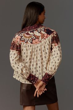 The Ainika Chill Blouse from Farm Rio features a collared neckline and a relaxed silhouette enhanced by playful patterns and eye-catching embroidery. | Ainika Chill Blouse by Farm Rio, Women's, Size: XL, Cotton at Anthropologie Chic Tops With Floral Print And Collared Neckline, Collared Patterned Blouse, Floral Print Spread Collar Blouse For Daywear, Chic Collared Blouse With Floral Embroidery, Bohemian Collared Tops With Floral Embroidery, Fall Floral Print Blouse With Collared Neckline, Feminine Patterned Blouse, Floral Print Blouse With Spread Collar For Daywear, Chic Embroidered Collared Tops