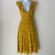 New With Tags, Golden Yellow Dress With Floral Detail. Deep V Front And Back, Tie-Back Detail. Side-Zip Closure. Measures 44” From Top Of Shoulder To Bottom Of Hem. Fitted Yellow Maxi Dress For Date Night, Mustard V-neck Midi Dress For Brunch, Chic Fitted Mustard Maxi Dress, Chic Fitted Mustard Midi Dress, Yellow Ruffled Knee-length Midi Dress, Yellow Ruffle Midi Dress For Date Night, Yellow Ruffled Midi Dress For Date Night, Yellow Ruffled Dress For Date Night, Yellow A-line Dress For Date Night