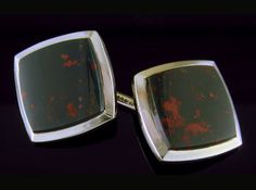 "Striking heliotropes set in bright, white gold bezels.  These cufflinks are in the elegant Art Moderne style of the late Art Deco period.  Created by Carter, Gough & Co. in 14kt gold circa 1930. Heliotrope, more commonly known as \"bloodstone,\" is a dark green variety of quartz with smoldering red spots that glow like fiery embers resting in a bed of dark ashes.  These elegant cufflinks are set with beautiful specimens of the alluring gemstone. The yellow gold backs of the cufflinks are as fin Modernist Oval Jewelry For Formal Occasions, Formal Rectangular Jewelry With Polished Edges, Luxury Formal Jewelry With Polished Edges, Art Deco Clip-on Jewelry For Formal Occasions, Formal Art Deco Clip-on Jewelry, Modernist Rectangular Jewelry For Formal Occasions, Clip-on Art Deco Jewelry For Formal Occasions, Art Deco Cabochon Jewelry For Formal Occasions, Art Deco Cabochon Jewelry For Formal Events