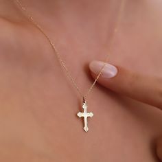 The dainty Cross Necklace, skillfully crafted in 14K Gold, is a refined and stylish accessory that brings an element of elegance to any outfit. It boasts a delicate cross pendant gracefully hanging from a fine gold chain, making it suitable for both everyday wear and special occasions. The use of 14k gold ensures not only durability but also a enduring radiance. Here are the essential details: Artisanally made from 14k solid gold All materials are responsibly sourced from the United States Size Elegant Necklace With Clavicle Chain And Cross Pendant, Elegant Clavicle Chain Jewelry With Cross Pendant, Minimalist 14k Gold Cross Pendant Necklace, Elegant Clavicle Chain With Cross Pendant Jewelry, Elegant Clavicle Chain With Cross Pendant, Elegant Tarnish-resistant Cross Pendant Necklace, Minimalist 14k Gold Cross Pendant Jewelry, Elegant Gold Necklaces With Cross Pendant, Elegant Gold Cross Pendant Necklaces