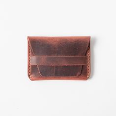 The flap wallet is the original wallet in the KMM & Co. collection. Each one is handmade and handstitched, the traditional way, with a flap that tucks neatly beneath a keeper. Handmade Classic Wallet, Classic Waxed Finish Wallets As Gifts, Classic Wallets With Waxed Finish As Gift, Classic Wallets With Waxed Finish For Gift, Everyday Trifold Wallet With Waxed Finish, Classic Handmade Wallet For Everyday Use, Artisan Trifold Wallet As Gift, Artisan Rectangular Trifold Wallet As Gift, Classic Handmade Trifold Wallet For Everyday