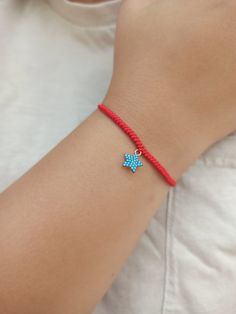 925 k high quality 18k Rose Gold plated star charm with turquoise cz diamonds.  Red string of fate, hand made snake knot woven bracelet.  Minimalist red string bracelet.  All our products are handmade in our workshop with high quality materials. We deliver with branded gift boxes.  Fast delivery.  Great gift for her, gift for mom, gift for mother, gift for girlfriend, friendship bracelets, knotted thread bracelet. Fine Jewelry Star-shaped Gemstone, Trendy Silver Jewelry With Sliding Knot, Adjustable Dainty Star Jewelry, Trendy Star Charm Pendant Jewelry, Trendy Bracelet With Sliding Knot, Adjustable Turquoise Jewelry With Star Charm, Fine Jewelry Star Shaped Gemstone, Resizable Sterling Silver Jewelry For Gifts, Star Shaped Gemstone Fine Jewelry