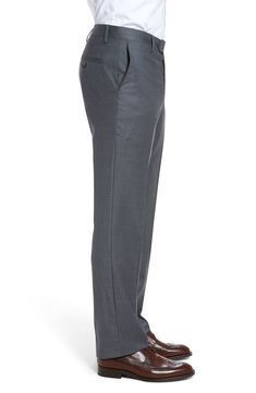 Stretch-infused wool gabardine defines handsome trousers crafted in a crisp, versatile flat-front cut. 16 1/2" leg opening; 9 1/4" front rise; 14 3/4" back rise Zip fly with button-tab closure Slant pockets; back button-closure welt pockets Unhemmed. These trousers can be hemmed for free at your local Nordstrom. Find a store Lined to the knee 98% wool, 2% spandex Dry clean Imported Men's Clothing Wool Trousers, Modern Fit, Welt Pocket, Welt Pockets, The Knee, Men's Clothing, Sweatpants, Dry Clean, Nordstrom