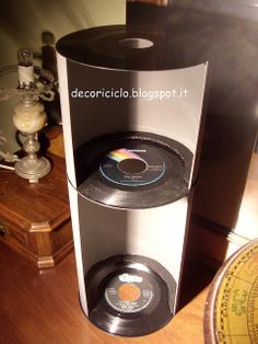 a record player sitting on top of a wooden table