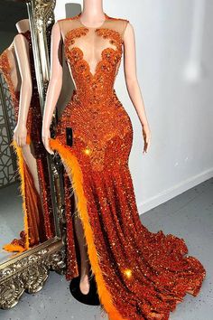 Indulge in the ultimate luxury with our Prom Queen Dress, crafted from stretchy fabric for a flawless fit. The vibrant orange color is accentuated by a dazzling rhinestone panel, feathers and delicate sequins, exuding elegance and sophistication. Perfect for proms or weddings, this Maxi style will elevate your look to new heights. Orange And Grey Prom Dress, Orange Prom Dresses Black Women, Red Prom Dress Inspiration, Neon Orange Prom Dress, Prom Dresses Orange, Burnt Orange Prom Dress, Prom Queen Dress, Orange Prom Dress, Autumn Princess