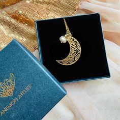 "Looking for a stunning piece of jewelry that will capture the beauty of the moon? Discover the elegance of our Filigree Moon necklace - a stunning gold piece featuring intricate open work  design. Shop our exquisite jewellery today! This Moon Necklace is the perfect way to stay connected to the moon's cycles no matter where you go. ♡ DETAILS  necklace: 2.8 cm-1.1\" Material:  sterling silver 925 or gold plated, natural pearl Chain Lenght please choose The jewelry is made entirely of 925 sterlin Elegant Moon Charm Jewelry Gift For Her, Gold Moon-shaped Wedding Jewelry, Elegant Gold Moon Phase Jewelry, Elegant Gold Jewelry With Moon Phase Detail, Celestial Pearl Pendant Jewelry As Gift, Moon Phase Round Pendant Necklace For Wedding, Dainty Moon Charm Necklace For Wedding, Crescent Moon Phase Necklace For Wedding, Wedding Necklaces With Moon Phase Round Pendant