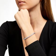 Wrap your wrist in the timeless sophistication of this diamond cushion-shaped link bracelet in sterling silver. Fashioned in sterling silver Each round diamond shimmers in a beaded cushion-shaped frame - all wrapped in an artful setting that enhances size and sparkle. Captivating with 1/2 ct. t.w. of diamonds This 7.25-inch bracelet secures with a box clasp. Elegant Cubic Zirconia Tennis Bracelet For Anniversary, Elegant Diamond Bracelet With Sparkling Stones For Anniversary, Elegant Diamond Bracelet With Sparkling Stones For Formal Events, Elegant White Tennis Bracelet With Diamond Accents, Classic Sparkling Jewelry Bracelet, Elegant Platinum Tennis Bracelet With Diamond Cut, Elegant Diamond Bracelet With Sparkling Stones, Formal Bracelet With Prong Setting, Elegant Sparkling Diamond Bracelet As Gift