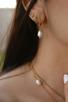 These small pearl drop hoops earrings are perfect for a classic and elegant look, they are made of 18k gold plated stainless steel. I particularly love these earrings for a bride/wedding occasion! Sold in pairs ITEM DETAILS Water Resistant- skin-friendly-Tarnish-free Material: 18k Gold plated stainless steel hoops Freshwater Pearls **Sizes: Small Hoop Diameter 0.59 in - 15mm Jewelry Care We at Alma Libre Jewelry understand that every person is different and we each have unique skin-oils that may Teardrop Hoop Earrings With Pearl Charm, Gold Plated, Classic Gold Plated Hoop Earrings With Pearl Drop, Classic Gold-plated Hoop Earrings With Pearl Drop, Elegant Gold Plated Huggie Earrings With Pearl Drop, Elegant Gold-plated Huggie Earrings With Pearl Drop, Teardrop Pearl Drop Huggie Earrings, Classic Teardrop Pearl Drop Huggie Earrings, Classic Dangle Hoop Earrings With Pearl Charm, White Pearl Pendant Huggie Earrings