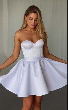 Look breathtakingly beautiful on your special day with this White Wedding Short Corset Dress. This enchanting ensemble features an Overbust Corset Top paired with a stunning Mini Skirt, making it perfect for a Birthday celebration or a fun Bachelorette Party. The Corset Bustier Top enhances your figure, while the flirty skirt adds a touch of elegance. Embrace your femininity and make a statement with this exquisite corset dress that will surely turn heads wherever you go. Make unforgettable memo White A-line Corset Dress For Prom, Elegant Mini Dress For Debutante Ball And Prom Season, Fitted Full Skirt Mini Dress For Party, Fitted A-line Corset Dress For Debutante Ball, Fitted Full Skirt Dresses For Debutante Ball, White Satin Dress For Homecoming, White Strapless Corset Dress For Homecoming, Fitted A-line Satin Skirt, Fitted Mini Dress For Prom Season And Debutante Ball