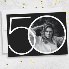 a black and white photo with the number fifty five on it, surrounded by stars