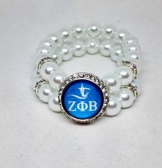 Zeta Phi Beta snap charm bracelet Bracelet will beaded with 10mm WHITE beads Made to order stretch bracelet Small, medium, large, XL Adjustable Beaded Stretch Bracelet In Pearl White, Adjustable Pearl White Beaded Stretch Bracelet, Adjustable White Round Pearl Bracelet, Adjustable Stackable White Pearl Bracelet, Adjustable White Stackable Pearl Bracelet, White Stackable Adjustable Pearl Bracelet, White Adjustable Stackable Pearl Bracelet, Adjustable Pearl White Jewelry With 8mm Beads, Nickel Free White Stretch Bracelet As Gift