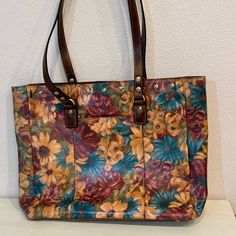 Used - Like New Multi-Color Leather Extra Large Patricia Nash Tote. 14" Wide, 12" High, 4" Across Bottom Slide In Pocket On Front And Back. Bottom Has Metal Button Feet. Zippered Pocket On Inside And 2 Elastic Pockets. Multicolor Leather Tote Bag, Retro Bags With Leather Lining For Everyday Use, Multicolor Soft Leather Tote Shoulder Bag, Vintage Yellow Bag With Removable Pouch, Multicolor Leather Bag With Removable Pouch, Retro Leather Tote Bag, Multicolor Leather Bag For Everyday Use, Multicolor Leather Everyday Bag, Multicolor Soft Leather Shoulder Bag For Daily Use