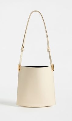 Find NEOUS Dorado 1.0 Shoulder Bag on Editorialist. Calfskin,Gold-tone hardware,Open top,Patch interior pocket,Suede lining,Weight: 10oz / 0.28kg,Made in Italy Gold Calf Leather Shoulder Bag With Brass Hardware, High-end Beige Shoulder Bag With Gold-tone Hardware, High-end Everyday Leather Bucket Bag, Gold Leather Bucket Bag For Formal Occasions, Gold Leather Bucket Bag For Formal Events, Gold Calf Leather Bag With Gold-tone Hardware, Modern Gold Shoulder Bag With Metal Hardware, Designer Gold Bucket Shoulder Bag, Formal Gold Leather Bucket Bag