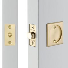 two white doors with brass handles and knobs