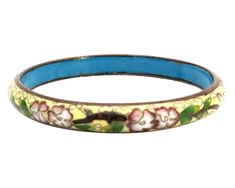 "This is from my personal collection. I received this beautiful bracelet from my mother in 1978 as a young stylish and headstrong woman of the 1970s. I wore it with pride for many years. It is a gold wire on enamel the cloisonne is a beautiful floral detail. They are genuine and come with my personal provenance. These are authentic 1978 Bohemian styles. They were purchased likely from Emporium Capwell in Fremont, CA. Fashion enamel jewelry decorated with gorgeous brightly colored flowers and pat Retro Handmade Bangle Jewelry, Vintage Jubilee Bangle As Gift, Vintage Jubilee Cuff Bracelet As Gift, Antique Bangle Bracelets As Gifts, Vintage Jubilee Cuff Bracelet Gift, Vintage Bangle Bracelets For Gift, Handmade Retro Bangle Bracelet, Antique Bangle Bracelets As A Gift, Vintage Jubilee Bracelet Gift