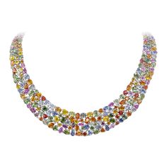 A stunning collar necklace, showcasing varying shapes and colors of vibrant sapphires weighing 161.55 carats total, set together seamlessly on 18K white gold. Accented by 14 small round brilliant cut diamonds weighing 0.80 carat total. An absolute work of art. Perfect for luxurious occasions. Roman Malakov is a custom house, specializing in creating anything you can imagine. If you would like to receive a special quote on a custom piece, please message or call us. Yellow Diamond Necklace, Sapphire Diamond Necklace, Wide Necklace, Colored Diamond Jewelry, Diamond Tops, Multi Coloured Necklaces, Multicolor Jewelry, Mesh Necklace, Tanzanite Jewelry