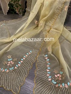 Beautiful gold dupatta with gota and embroidery motifs. Luxury Gold Dupatta With Motifs, Luxury Semi-stitched Dola Silk Dupatta, Celebration Unstitched Tissue Silk Suit With Gota Work, Embroidered Tissue Silk Fabric With Gota Work, Cream Dola Silk Dupatta With Cutdana, Beige Anarkali Dupatta With Gota Work, Cream Traditional Wear With Sheer Dupatta For Festivals, Gold Embroidered Fabric With Dabka Work For Party, Gold Unstitched Organza Suit