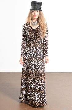 "70's Leopard Print Maxi Dress/ Leopard Print Empress Dress/ Vintage Leopard Print Dress/ Stevie Nicks Dress/ Size S Incredible 70's polyester knock out dress! In wonderful condition. Decorative buttons on the front upper portion of empress pipping. Zippers up the back. That's it! Amazing! So simple and easy to wear and yet so unbelievably chic! Leopard print maxi dress for all occasions! There is no tag. Model is 5'4\" and a size 4 for scale. Please see dress measurements below. Shoulder to sho Bohemian Fitted Long Sleeve Dress For Fall, Fitted Bohemian Long Sleeve Dress For Fall, 70s Inspired Fitted Maxi Dress, Retro Fitted Dresses For Festival, Vintage Maxi Dress For Fall Festival, Retro Maxi Dress For Festival, Fall Festival Brown Maxi Dress, 70s Inspired Long Sleeve Party Dresses, Leopard Print Maxi Dress For Fall