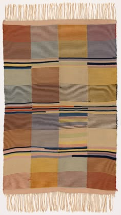 a multicolored rug with fringes on it