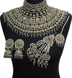 Indian luxury bridal jewellery set. Set includes - Earrings  Necklace  Jhumar  Tikka Silver Sets With Stone Work For Ceremonial Occasions, Ceremonial Silver Sets With Stone Work, Traditional Gray Wedding Sets, Silver Kundan Necklace With Tilla For Wedding, Silver Meenakari Bridal Earrings For Wedding, Bollywood Style Silver Jewelry Sets For Ceremonial Occasions, Silver Chandbali Lehenga With Tilla Details, Silver Kundan Lehenga For Wedding, Festive Silver Meenakari Wedding Jewelry