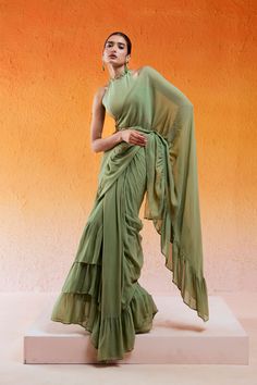 Featuring a pista green drape saree set with belt in georgette base with sequin, moti, and cutdana hand embroidery. It is paired with a matching embroidered crushed crape organza blouse and a belt. Green Georgette Draped Saree, Green Draped Lehenga With Cutdana, Draped Georgette Traditional Wear With Mirror Work, Green Draped Saree With Unstitched Blouse, Green Bollywood Draped Set, Festive Green Pre-draped Saree, Green Draped Sets With Zari Work, Traditional Green Draped Blouse Piece, Traditional Green Draped Dupatta