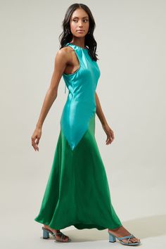 Step out and turn some heads in the Kavela sheath maxi. Features a halter inspired neckline with an adjustable strap. It maintains a sleek, sheath fit. Slightly widends towards the hem. Pair it with strappy heels and your go-to accessories.- Heavyweight Satin- Drawstring- Keyhole- Sheath- Comes in 3 colorsSize + Fit - Model is 5'10" and wearing size XS- Measurements taken from size S - Chest: 16 3/4"- Length: 55" Fabric Self:96% Polyester 4%Spandex Lining:95% Polyester 5%Spandex Style Number STD Green Maxi Length Halter Dress For Evening, Spring Halter Neck Maxi Dress With Bias Cut, Green Maxi Length Halter Dress For Party, Green Maxi Halter Dress For Evening, Green Satin Halter Neck Dress, Green Halter Maxi Dress For Evening, Green Halter Neck Dress For Evening, Green Halter Dress For Evening, Fitted Green Maxi Dress With Bias Cut