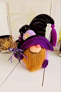 a purple and black gnome head sitting on top of a table