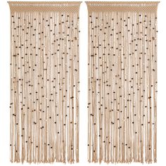 two beige curtains with beads hanging from them