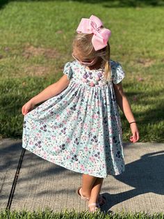 Floral flow dress. High waist. Cute tie in the back. Super flowy. Comfortable and soft. Flutter Sleeve Dresses With Smocked Back For Garden Party, Garden Party Dress With Smocked Back And Flutter Sleeves, Flowy A-line Dress With Smocked Back, Flowy A-line Sundress For Dress Down Occasions, Flowy Floral Dress With Smocked Back And Short Sleeves, Flowy A-line Breezy Dress, Spring Tie Back Dress For Garden Party, Spring Garden Party Dress With Tie Back, Flowy Floral Print Dress With Flutter Sleeves