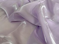 the fabric is very soft and shiny with some light purple colors on it's surface