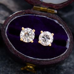 These traditional diamond stud earrings are each accented with one (1) round brilliant cut diamond set into a four-prong setting. The 14k yellow gold earrings are finished with posts and friction backs for pierced ears. Timeless Yellow Gold Diamond Earrings For Formal Occasions, Classic Yellow Gold Diamond Earrings For Formal Occasions, Classic Brilliant Cut Earrings For Formal Occasions, Classic Diamond Cut Diamond Earrings For Formal Occasions, Luxury Yellow Gold Diamond Earrings With Brilliant Cut, Luxury Brilliant Cut Yellow Gold Diamond Earrings, Luxury Yellow Gold Brilliant Cut Diamond Earrings, Classic Brilliant Cut Diamond White Earrings, Luxury Yellow Gold Round Cut Earrings