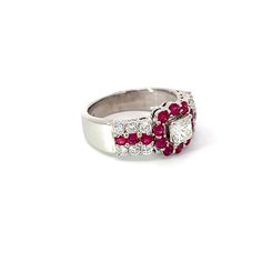 This exquisite 18k white gold ring features a stunning 1.15 carat diamond center stone, surrounded by vivid rubies for an eye-catching contrast. The ruby's vibrant hue adds sparkle to the classic diamond design. Jewelry Style : RingMetal Type : 18K White Gold Ruby : 16, approximately 1.04 CtwDiamonds : Center approximately 0.55 ct. Color I, Clarity VS12 round, approximately 0.60 ctw Color G-H Clarity VSApproximate Weight : 8.36 gramsRing Size : 7.25estate piece 15 Carat Diamond Ring, Luxury Multi-stone Ruby Ring With Diamonds, Fine Jewelry Multi-stone Ruby Ring In White Gold, Gia Certified Luxury Vintage Ruby Ring, Luxury Multi-stone Ruby Ring Fine Jewelry, Exquisite Brilliant-cut Ruby And Diamond Ring, Jewelry Style, Design Jewelry, White Gold Ring