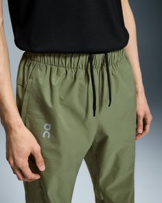 Lightweight and stretchy, these pants are dedicated to enhancing the joy of running. Made to move with you. Any direction. Any rhythm. The Core Pants move with you, thanks to an elastic waistband, gusset insert and pre-shaped knee construction. Plus, a hem that zips up to the knee makes changing into your gear a breeze. Engineered for 100% focus. No distractions. Just the run. A drawcord at the waist ensures a secure fit. And two side pockets mean you can keep essentials to hand. The lightweight Sporty Workout Pants With Elastic Waistband, Functional Sports Pants With Elastic Waistband, Sporty Ankle-length Cargo Pants With Elastic Waistband, Stretch Cargo Pants With Elastic Waistband For Workout, Sportswear Pants With Elastic Waistband For Workout, Athleisure Pants With Elastic Waistband For Gym, Sports Ankle-length Pants With Elastic Waistband, Sports Bottoms With Elastic Waistband And Ankle-length, Versatile Sports Pants With Elastic Waistband